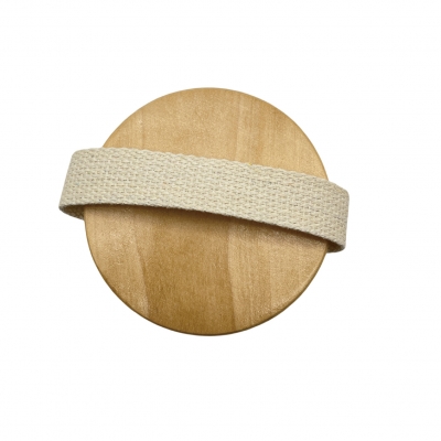 Hand grabbing round massage bath brush